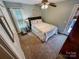 Light bedroom with carpeted floors and a doorway to the outside at 3273 16Th Ne St, Hickory, NC 28601
