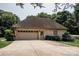 Detached garage with an American flag, a driveway, and surrounding greenery at 3273 16Th Ne St, Hickory, NC 28601