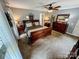 Cozy main bedroom featuring a ceiling fan, carpet and coordinating wooden furniture at 3273 16Th Ne St, Hickory, NC 28601