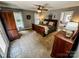 Spacious main bedroom with hardwood furniture, plush carpet and natural light from windows at 3273 16Th Ne St, Hickory, NC 28601