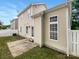 Exterior view of a home with a backyard featuring a small patio area and partial fencing at 3436 Ibis Ln, Fort Mill, SC 29707