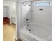 Well-lit bathroom showcasing a white bathtub and a view into the vanity area at 3436 Ibis Ln, Fort Mill, SC 29707