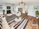 Bright living room with fireplace, modern furnishings, and hardwood flooring at 3436 Ibis Ln, Fort Mill, SC 29707