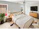 Bright main bedroom featuring neutral decor, ceiling fan and ample natural light at 3436 Ibis Ln, Fort Mill, SC 29707