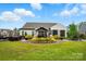 Expansive backyard featuring a charming patio with a gazebo and outdoor seating at 5357 Pembrey Dr, Denver, NC 28037