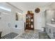 A bathroom featuring a stand up shower with unique tile flooring, neutral walls, and bright lighting at 5357 Pembrey Dr, Denver, NC 28037