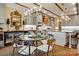 Bright dining room with a glass table, designer chandelier, and seamless flow to the kitchen at 5357 Pembrey Dr, Denver, NC 28037