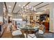 Dining room showcases an elegant glass table, stylish seating, and an open flow to the kitchen at 5357 Pembrey Dr, Denver, NC 28037
