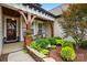 Cozy front porch with seating area, detailed wood accents, and manicured landscaping at 5357 Pembrey Dr, Denver, NC 28037