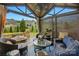 Elegant gazebo interior featuring comfortable seating, fire pit and stylish decor at 5357 Pembrey Dr, Denver, NC 28037