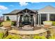 Outdoor patio features an elegant gazebo with comfortable seating and fire pit at 5357 Pembrey Dr, Denver, NC 28037