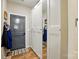 Inviting hallway with practical storage cabinets, and a view of the front door at 5357 Pembrey Dr, Denver, NC 28037
