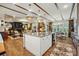 Open-concept kitchen with a spacious island, seamlessly connecting to the living and dining areas at 5357 Pembrey Dr, Denver, NC 28037