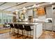Spacious kitchen with a large center island, designer lighting, stainless appliances, and breakfast nook at 5357 Pembrey Dr, Denver, NC 28037