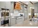 Updated kitchen featuring stainless steel appliances, designer hood, and quartz countertops at 5357 Pembrey Dr, Denver, NC 28037