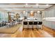 Bright, open kitchen with island seating, modern appliances, and hardwood flooring at 5357 Pembrey Dr, Denver, NC 28037