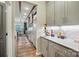 Kitchen with a long countertop, pendant lights, and open to the dining area at 5357 Pembrey Dr, Denver, NC 28037