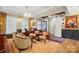 Sophisticated living room with a sliding barn door, hardwood floors and refined decor at 5357 Pembrey Dr, Denver, NC 28037