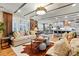 Open-concept living space with a connected kitchen and dining area; natural light at 5357 Pembrey Dr, Denver, NC 28037