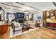 Comfortable living room featuring a fireplace, exposed beams, and stylish furnishings at 5357 Pembrey Dr, Denver, NC 28037