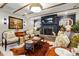 Spacious living room featuring a cozy fireplace, hardwood floors, and stylish decor at 5357 Pembrey Dr, Denver, NC 28037