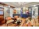 Inviting living room featuring stylish seating, unique decor, and ample lighting at 5357 Pembrey Dr, Denver, NC 28037