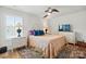 Serene main bedroom with a ceiling fan, soft lighting, and hardwood flooring at 5357 Pembrey Dr, Denver, NC 28037