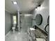 Updated bathroom with gray walls, glass shower, black accents, and modern vanity at 5458 Foxcroft Dr, Fort Lawn, SC 29714