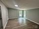 Spacious bedroom featuring hardwood flooring and two windows for natural lighting at 5458 Foxcroft Dr, Fort Lawn, SC 29714