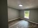 Bedroom featuring hardwood flooring, neutral walls, and window view at 5458 Foxcroft Dr, Fort Lawn, SC 29714
