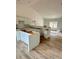 Spacious kitchen featuring white cabinets and hardwood floors, ready for personalization at 63 Cornerstone Dr, Taylorsville, NC 28681