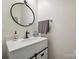 Neutral bathroom with black fixtures and a white quartz countertop at 7931 Baylis Dr, Huntersville, NC 28078