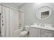 Bathroom featuring shower, vanity, and toilet with a round mirror at 7931 Baylis Dr, Huntersville, NC 28078