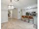 Kitchen view highlighting the breakfast bar, white cabinets, stainless appliances and modern lighting at 7931 Baylis Dr, Huntersville, NC 28078