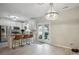 Bright kitchen with stainless steel appliances, kitchen island with seating, and access to the patio at 7931 Baylis Dr, Huntersville, NC 28078