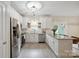 Modern kitchen featuring stainless steel appliances, sleek countertops, and ample cabinet space for storage at 7931 Baylis Dr, Huntersville, NC 28078