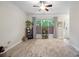 Inviting living room area with large window, neutral walls, ceiling fan, and stylish decor at 7931 Baylis Dr, Huntersville, NC 28078
