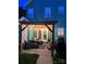 Relaxing outdoor patio with string lights, stylish furniture, and an outdoor grill for entertaining guests at 7931 Baylis Dr, Huntersville, NC 28078