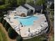 Community pool area with lounge chairs, tables, and well-maintained landscaping at 7931 Baylis Dr, Huntersville, NC 28078