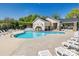 Community pool with ample seating and a covered area for relaxing at 7931 Baylis Dr, Huntersville, NC 28078