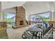 Poolside lounge area featuring a stone fireplace and shaded seating at 7931 Baylis Dr, Huntersville, NC 28078