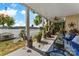 Outdoor patio with ceiling fan overlooks lake with water views and comfortable seating at 812 Bell Post Rd, Belmont, NC 28012