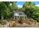 Waterfront property with lush landscaping and a private dock for lake access at 812 Bell Post Rd, Belmont, NC 28012