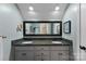 Bathroom featuring double sinks with granite countertops and a decorative framed mirror at 812 Bell Post Rd, Belmont, NC 28012