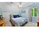 Cozy blue bedroom with a comfortable queen-sized bed and natural light at 812 Bell Post Rd, Belmont, NC 28012