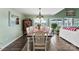 Inviting dining room featuring lake views, stylish furnishings, and access to an outdoor area at 812 Bell Post Rd, Belmont, NC 28012