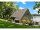Landscaped home with lake access, featuring an attached carport and a charming yard with mature trees at 812 Bell Post Rd, Belmont, NC 28012