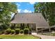 Charming home with a well-maintained lawn and welcoming front entrance with mature trees at 812 Bell Post Rd, Belmont, NC 28012