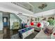 Spacious living area with high ceilings, a staircase, and an open layout connecting to the dining area at 812 Bell Post Rd, Belmont, NC 28012
