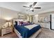 Comfortable main bedroom with a ceiling fan, neutral decor, and bright, natural light at 812 Bell Post Rd, Belmont, NC 28012